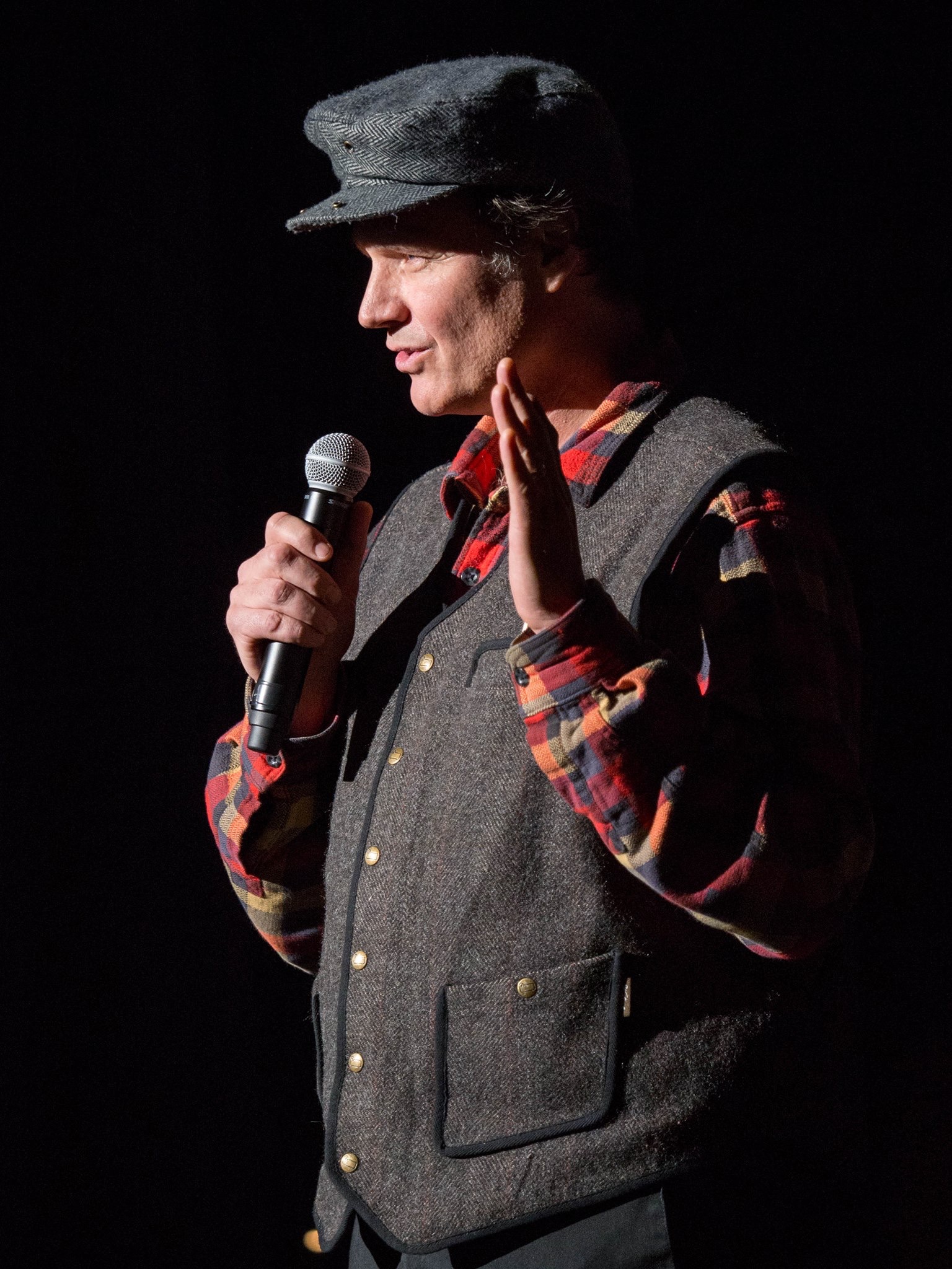Timothy Frantzich speaking onstage with a microphone